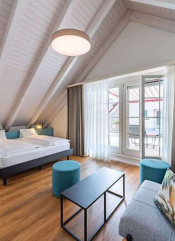 Modern bedroom with sloping ceiling
