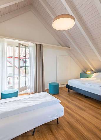 Modern bedroom with sloping ceiling