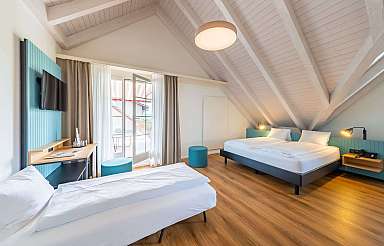 Modern bedroom with sloping ceiling