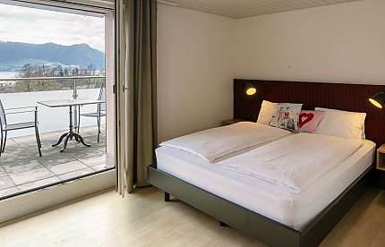 Bedroom with balcony view