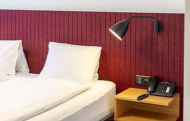 Hotel room with bedside table