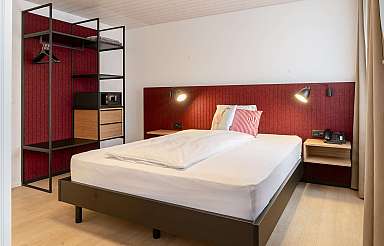 Modern bedroom with red accent