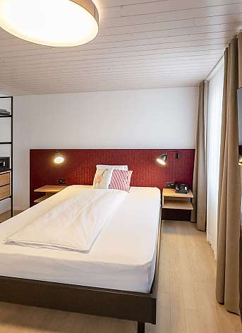 Modern hotel room with single bed