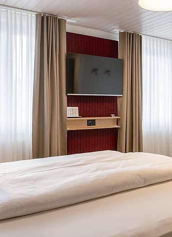 Modern hotel room with television