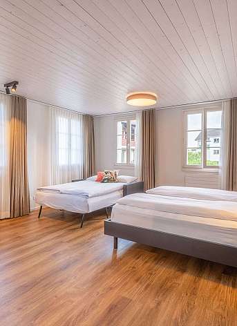 Modern bedroom with wooden ceiling
